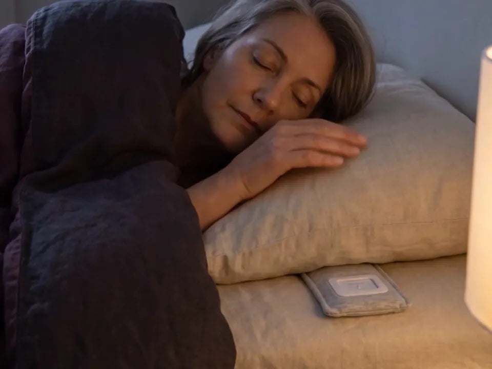 She lifts the edge of the pillow